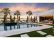 Resort-style backyard oasis with a large pool, spa, and outdoor kitchen at 24351 N 97Th Dr, Peoria, AZ 85383