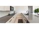 Modern kitchen features sleek countertops, contemporary cabinetry, and high-end appliances at 24351 N 97Th Dr, Peoria, AZ 85383