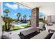 Spacious covered patio overlooks the pool and backyard, perfect for entertaining at 24351 N 97Th Dr, Peoria, AZ 85383