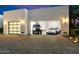 Modern garage featuring high-end vehicles, showcasing luxury at 24351 N 97Th Dr, Peoria, AZ 85383