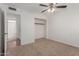 Bedroom with ceiling fan, closet, and access to hallway at 3837 W Dailey St, Phoenix, AZ 85053
