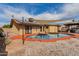 Relaxing kidney shaped pool with shade sail and solar panels at 3837 W Dailey St, Phoenix, AZ 85053