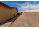 Side yard with gated access and paved pathway at 3837 W Dailey St, Phoenix, AZ 85053