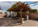 Backyard patio with pergola, grill, and seating area at 3837 W Dailey St, Phoenix, AZ 85053