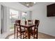 Charming breakfast nook with wood table and chairs, overlooking the pool at 3837 W Dailey St, Phoenix, AZ 85053