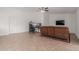 Living room with tile floors, brown couches, and ceiling fan at 3837 W Dailey St, Phoenix, AZ 85053