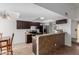 Kitchen with dark brown cabinets, granite countertops, and tile floors at 3837 W Dailey St, Phoenix, AZ 85053
