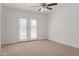 Bedroom with carpet, ceiling fan, and access to the pool at 3837 W Dailey St, Phoenix, AZ 85053