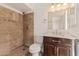 Updated bathroom with a large shower and dark brown vanity at 3837 W Dailey St, Phoenix, AZ 85053