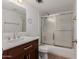 Bathroom boasts a vanity with granite countertop and shower/tub combo at 3837 W Dailey St, Phoenix, AZ 85053