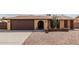 House exterior featuring a two-car garage and desert landscaping at 3837 W Dailey St, Phoenix, AZ 85053
