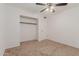 Simple bedroom with neutral carpeting and a closet at 3837 W Dailey St, Phoenix, AZ 85053