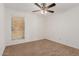 Bright bedroom with ceiling fan and window coverings at 3837 W Dailey St, Phoenix, AZ 85053