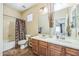 Clean bathroom with double sinks and a shower/tub combo at 9146 W Meadow Dr, Peoria, AZ 85382