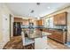 Kitchen with large granite island and ample cabinet space at 9146 W Meadow Dr, Peoria, AZ 85382