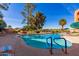 Relaxing community pool with ample deck space at 12222 N Paradise Village Pkwy # 142, Phoenix, AZ 85032