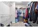 Large walk-in closet with ample shelving and hanging space at 42999 W Samuel Dr, Maricopa, AZ 85138