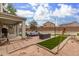 Backyard patio with seating area, artificial turf, and a pool at 42999 W Samuel Dr, Maricopa, AZ 85138