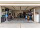 Garage with shelving and storage for bikes and equipment at 42999 W Samuel Dr, Maricopa, AZ 85138
