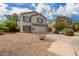 Two-story house with attached garage and desert landscaping at 42999 W Samuel Dr, Maricopa, AZ 85138