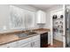 Bright kitchen features stainless steel appliances and ample cabinetry at 42999 W Samuel Dr, Maricopa, AZ 85138