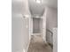 Long hallway with carpeted floors leading to bedrooms at 42999 W Samuel Dr, Maricopa, AZ 85138