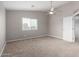 Spacious bedroom with ceiling fan and large closet at 42999 W Samuel Dr, Maricopa, AZ 85138