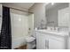 Clean bathroom with a bathtub, toilet and white vanity at 42999 W Samuel Dr, Maricopa, AZ 85138