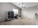 Bedroom with home gym setup and ceiling fan at 42999 W Samuel Dr, Maricopa, AZ 85138