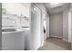 Convenient laundry room with washer, dryer, and storage at 42999 W Samuel Dr, Maricopa, AZ 85138