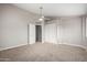 Spacious bedroom with ceiling fan and double door closet at 42999 W Samuel Dr, Maricopa, AZ 85138