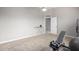 Bright bedroom with built-in shelving and gym equipment at 42999 W Samuel Dr, Maricopa, AZ 85138