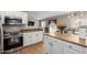 Modern kitchen with white cabinets and granite counters at 42999 W Samuel Dr, Maricopa, AZ 85138