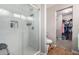 Bathroom with walk-in shower, toilet, and a spacious closet at 42999 W Samuel Dr, Maricopa, AZ 85138