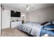 Spacious bedroom with a large bed, TV and plenty of storage at 42999 W Samuel Dr, Maricopa, AZ 85138