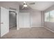 Large bedroom with ceiling fan and double door closet at 42999 W Samuel Dr, Maricopa, AZ 85138