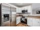 Modern kitchen with stainless steel appliances at 42999 W Samuel Dr, Maricopa, AZ 85138