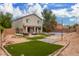 Home with a large backyard, a pool, patio furniture, and artificial turf at 42999 W Samuel Dr, Maricopa, AZ 85138
