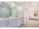 Spa-like bathroom with double vanity and a shower at 7300 E Earll Dr # 2021, Scottsdale, AZ 85251