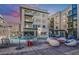 Community pool with lounge chairs and fire pit at 7300 E Earll Dr # 2021, Scottsdale, AZ 85251