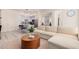 Open living area with modern sectional sofa and kitchen island at 7300 E Earll Dr # 2021, Scottsdale, AZ 85251