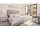 Spacious bedroom with plush bed and large window at 7300 E Earll Dr # 2021, Scottsdale, AZ 85251