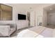 Bright bedroom with king-size bed and sitting area at 7300 E Earll Dr # 2021, Scottsdale, AZ 85251