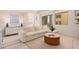Bright living room featuring a sectional sofa and large window at 7300 E Earll Dr # 2021, Scottsdale, AZ 85251