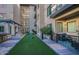 Courtyard with cornhole and putting green at 7300 E Earll Dr # 2021, Scottsdale, AZ 85251
