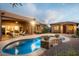 Luxury backyard oasis with a freeform pool and patio at 36482 N Boulder View Dr, Scottsdale, AZ 85262