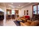 Spacious game room with kitchenette, leather furniture, and large TV at 36482 N Boulder View Dr, Scottsdale, AZ 85262