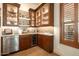 Well-appointed wet bar featuring wood cabinetry and wine storage at 36482 N Boulder View Dr, Scottsdale, AZ 85262