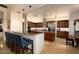 Island kitchen with seating and stainless steel appliances at 36482 N Boulder View Dr, Scottsdale, AZ 85262