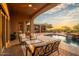 Inviting backyard oasis with pool, patio furniture, and sunset view at 36482 N Boulder View Dr, Scottsdale, AZ 85262